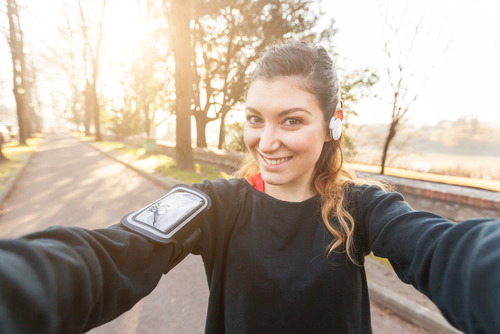 Determined woman capturing a post-workout selfie