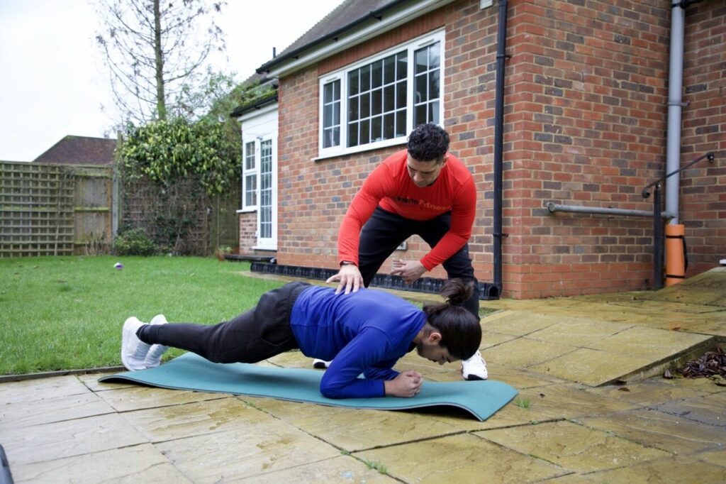 Personal trainer and client working out outdoors for a healthy and active lifestyle